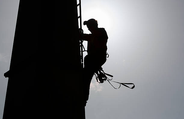 istock Cabin lift pillar silhouette and rescuer 524449741
