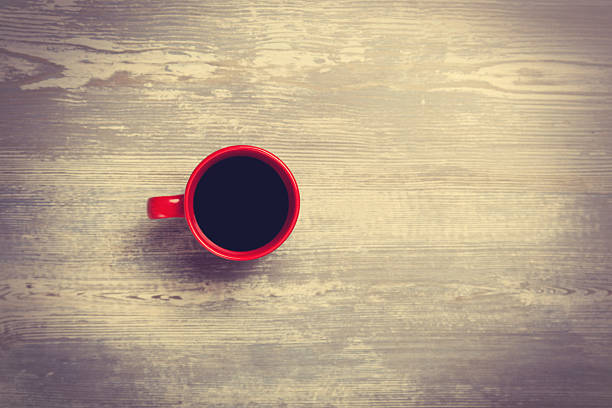 istock Cup of coffee on wooden table. 524452581