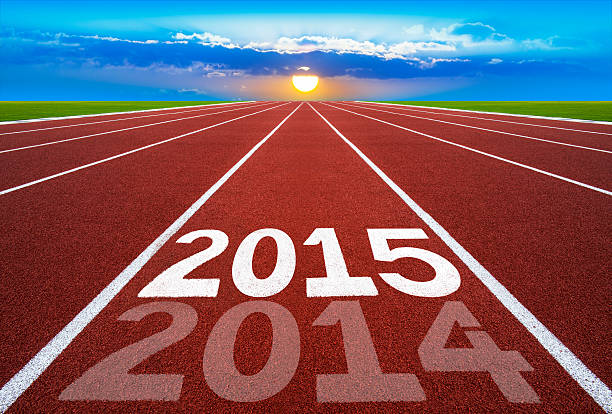 istock New Year 2014 on running track concept with sun 524452715
