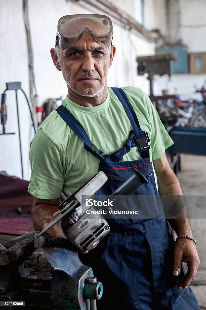 Craftsman Craftsman posing in workshop Adult Stock Photo