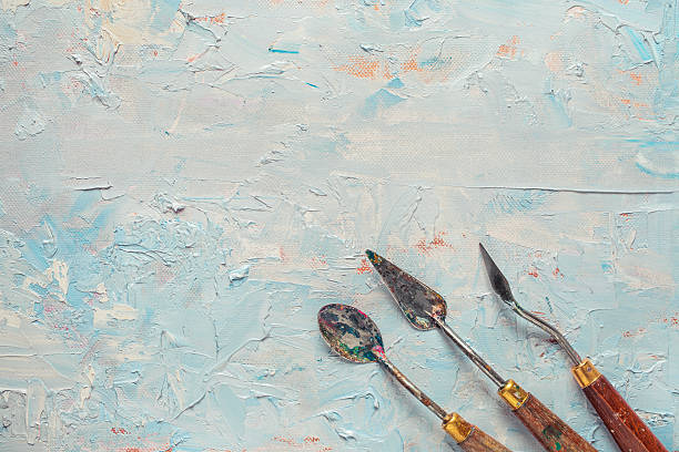 três paleta knifes em lona com artista pintura a óleo - primed - fotografias e filmes do acervo