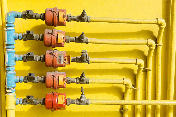 Old outdoor home water valve and water meter stock photo