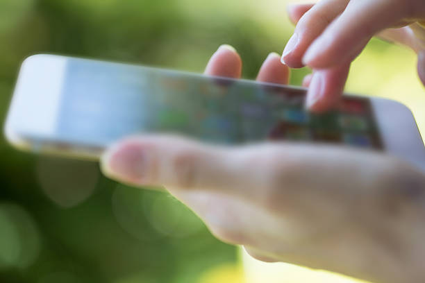 istock Woman holding  phone 524472459