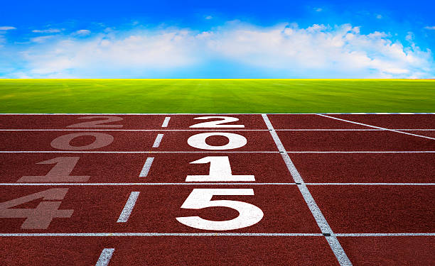 istock New Year 2015 on running track concept with blue sky. 524475227