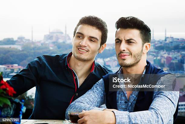 Two Male Friends Checking Out Girls At Istanbul Rooftop Cafe Stock Photo -  Download Image Now - iStock