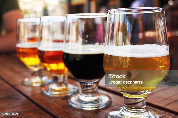 Beer Flight Of Four Beers In Glasses Stock Photo - Download Image Now - Beer - Alcohol, Flying, Tasting