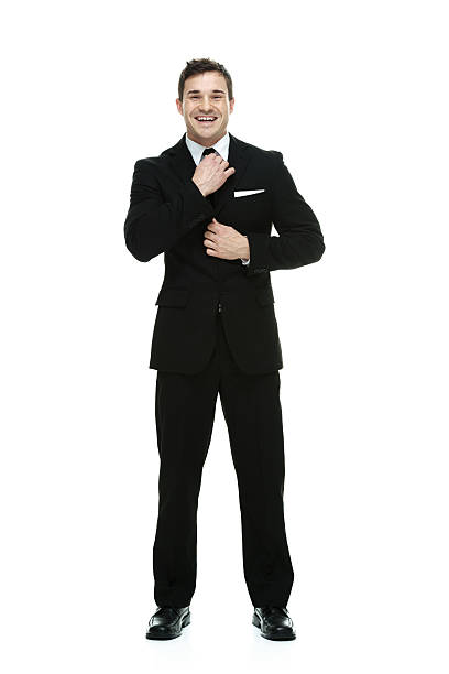 istock Cheerful businessman standing & looking at camera 524508957