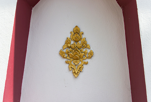 the art of handmade asian golden sculpture tracery for decorating on the white wall