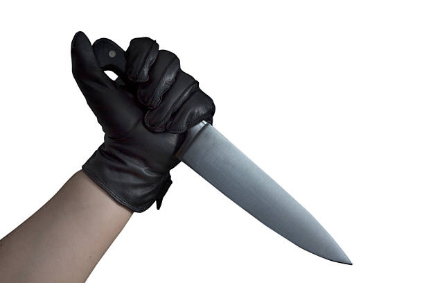 istock Hand in leather gloves holding knife 524512139
