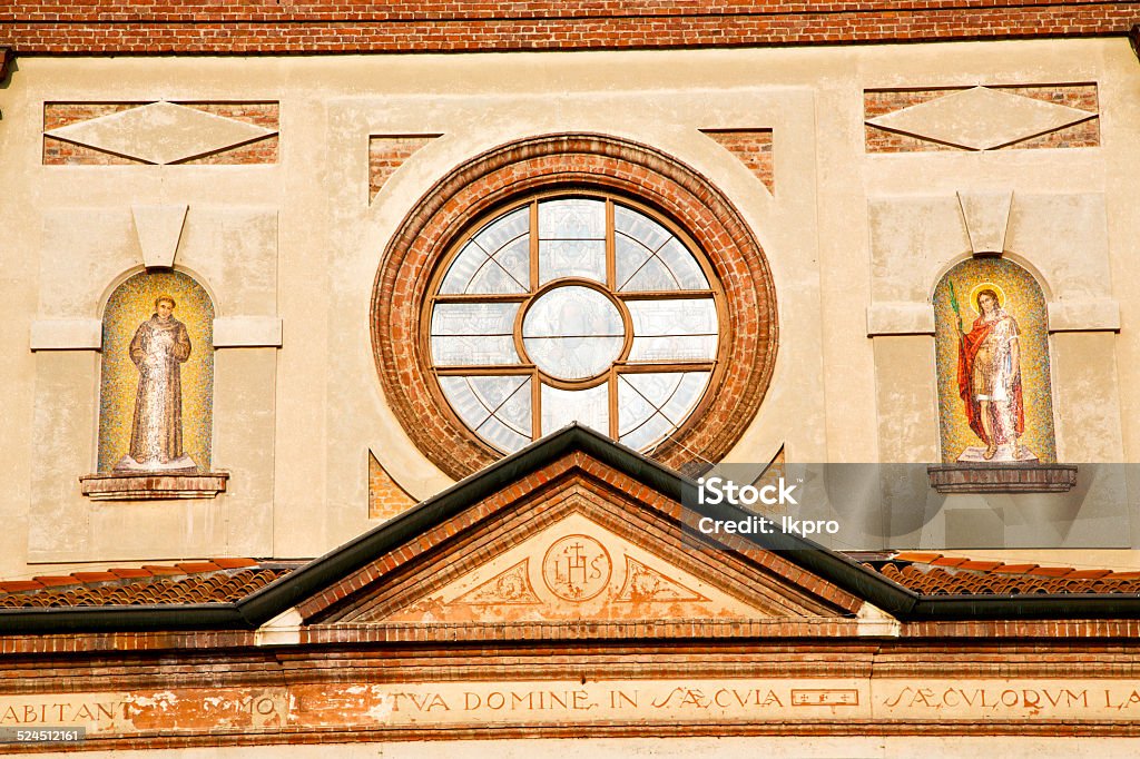 rose window  italy  lombardy     in  the parabiago    closed bri italy  lombardy     in  the parabiago  old   church   closed brick tower   wall rose   window tile Architectural Column Stock Photo