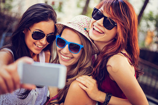 istock Teenagers making selfie with smart phone 524512595