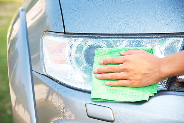 istock Cleaning car with green microfiber cloth 524524516