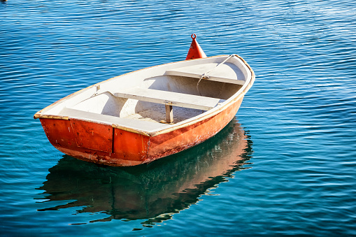 small row boat - handmade - at a lake