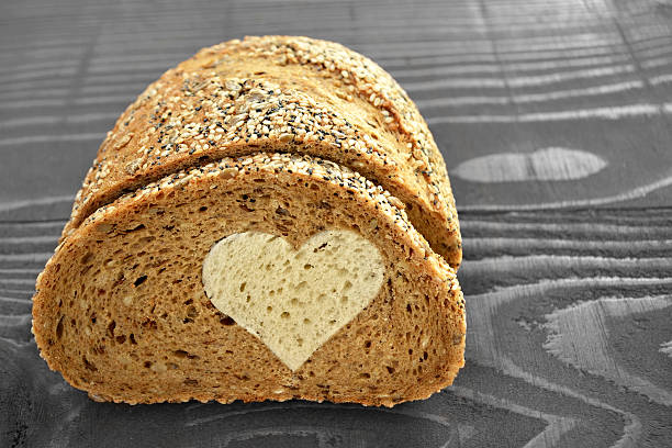 Whole wheat bread on wooden background