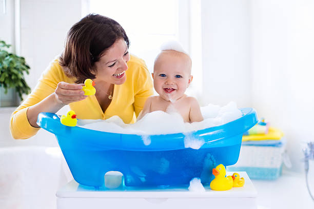 istock Young mother bathing baby boy 524531324
