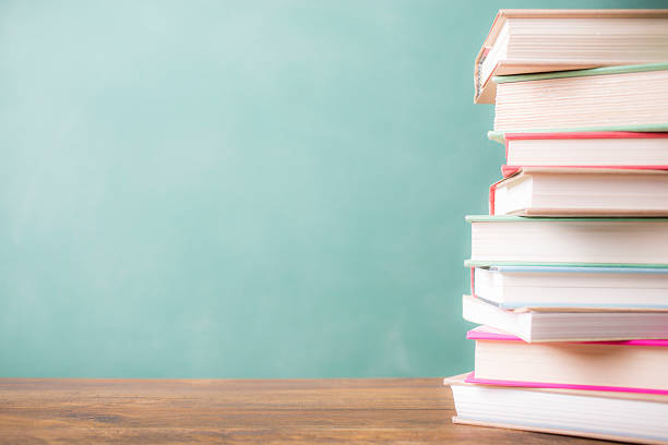 istock Back to school. Education. Textbooks stacked on desk. Chalkboard. 524532676