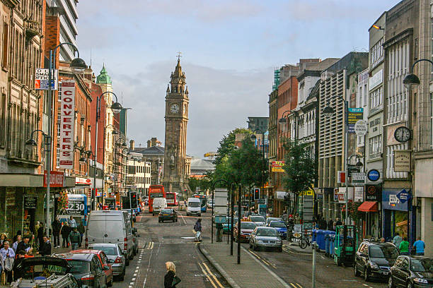 Belfast Leaning Clock Tower Downtown Belfast indicating shoppers, stores, traffic, cars, and the leaning clock tower. belfast photos stock pictures, royalty-free photos & images