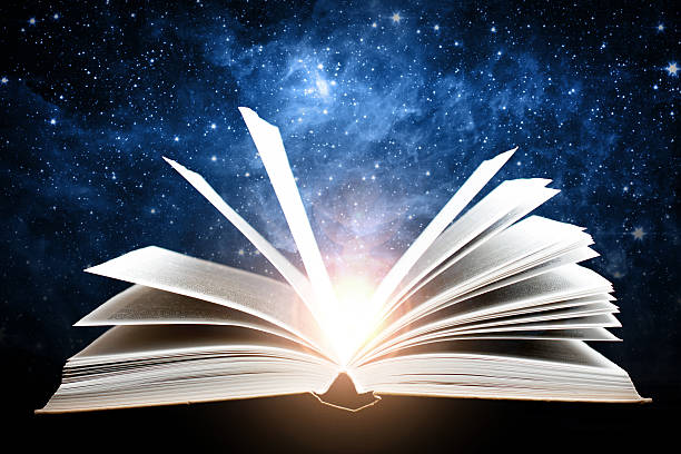 istock Opened book with galaxy. Elements of this image furnished by 524533382