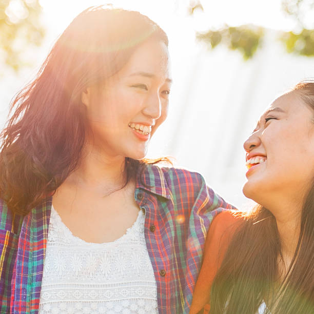 istock Sister Friendship Embracing Adorable Outside Concept 524533686