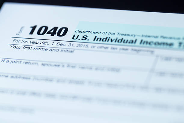 the newest 1040 tax form the newest 1040 tax form on touch pad screen IRS Headquarters Building stock pictures, royalty-free photos & images