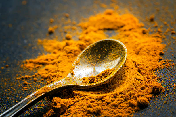 istock Ground turmeric or curcuma, black background 524534460