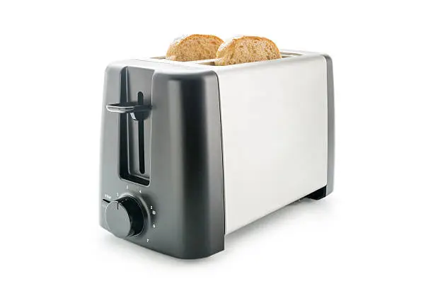 Electric toaster with two wholemeal bread slices loaded isolated on white background.
