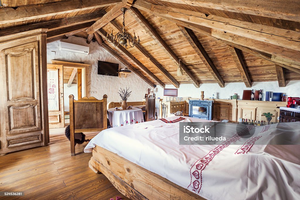 Rustic attic bedroom interior Indoors Stock Photo