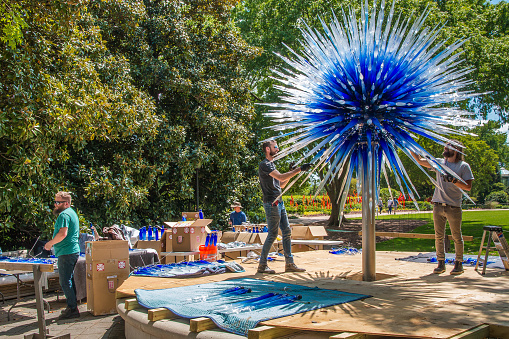 Atlanta, Georgia, USA -  APRIL, 23 2016:  Installing a glass sculpture for the exhibition of glass artist Chihuly in the Atlanta Botanical Garden in Atlanta, Georgia in 2016.