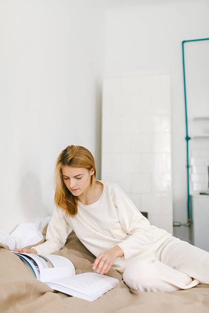istock Girl with magazine 524536869