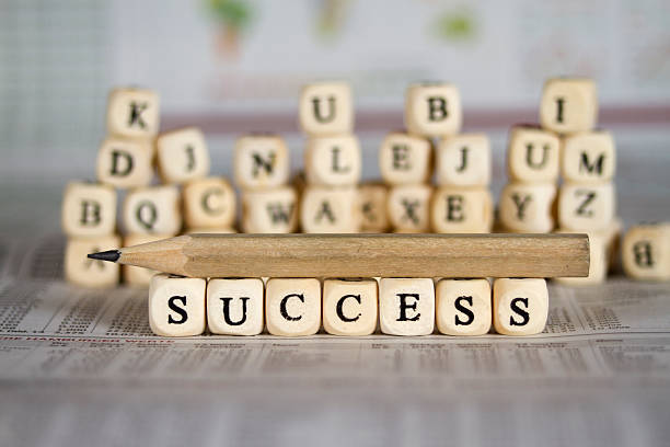 istock success word on newspaper background 524537081