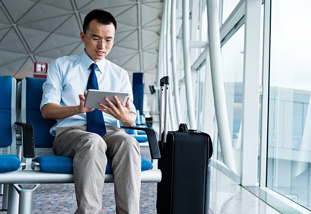 istock businessman at departure lounge 524538023