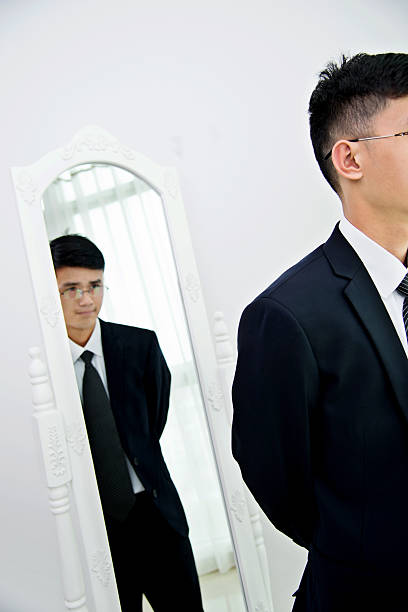 istock Young businessman with bizarre reflection 524538684