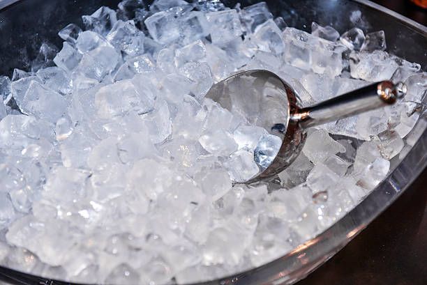 ice with scoop in ice bucket ice with scoop in ice bucket, preparation of ice in a bar for event party cooler stock pictures, royalty-free photos & images