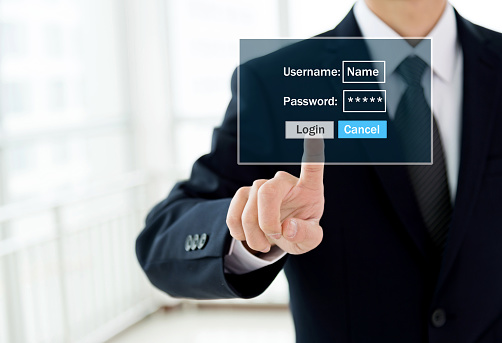 Businessman entering the password on a virtual screen.