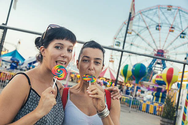 istock Happy Young Women eating Lollipop 524540101