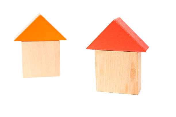 istock toy blocks shape like two houses on white background 524540202