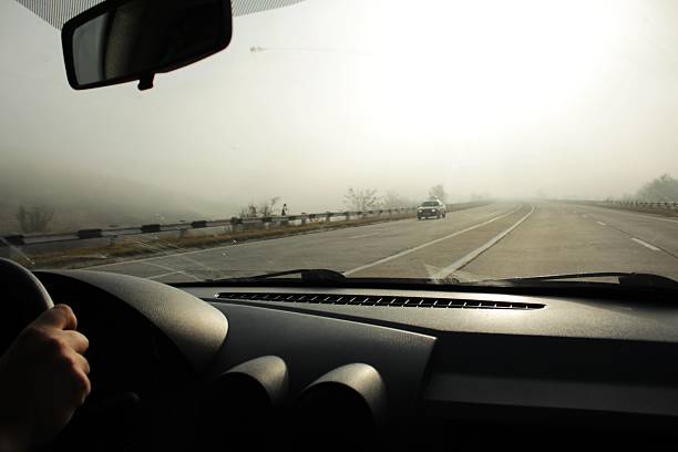 istock Sun through the fog on the road 524540357