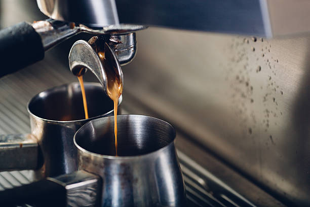 istock close-up of espresso pouring from coffee machine 524540582