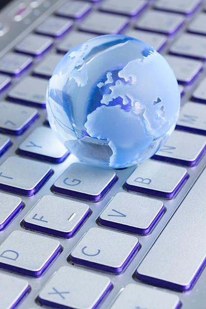 istock business concept with  globe on laptop keyboard 524541289