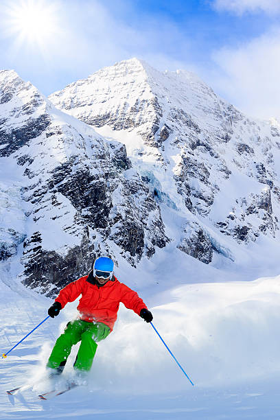 istock Freeride in fresh powder snow - man skiing downhi 524542011