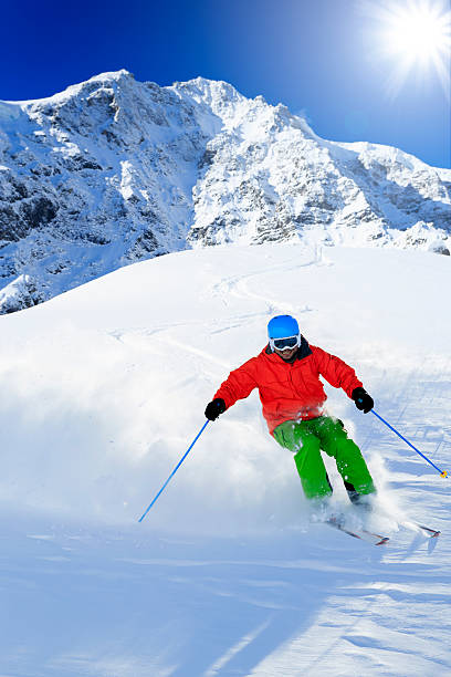 istock Freeride in fresh powder snow - man skiing downhi 524542015