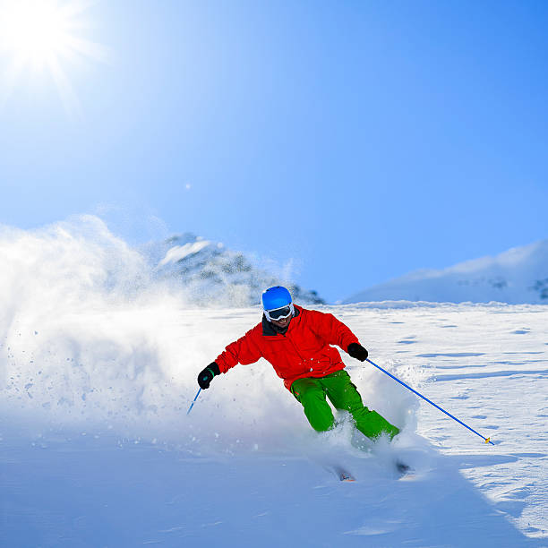 istock Freeride in fresh powder snow - man skiing downhi 524542017