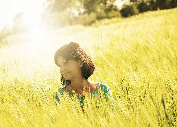 istock Woman enjoying spring in wheat field 524542409