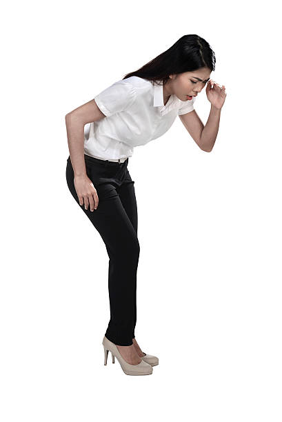 Asian business woman looking down isolated over white background