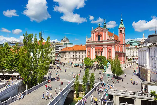 Romantic Ljubljana city center. River Ljubljanica, Triple Bridge - Tromostovje, Preseren square and Franciscan Church of the Annunciation. Ljubljana Slovenia Europe.