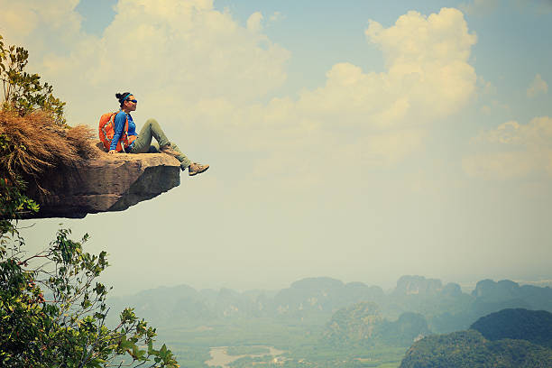 istock young asian woman enjoy the view at  mountain peak 524543396