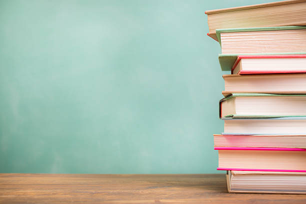 istock Back to school. Education. Textbooks stacked on desk. Chalkboard. 524545018
