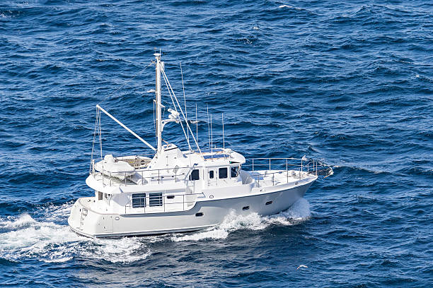 istock White boat sailing on the open ocean 524545270