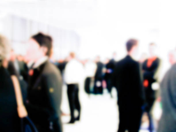 istock people on trade fair convention - blurred 524545686