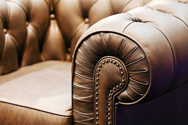 Sofa detail Detail of classic furniture sofa in living room. leather cushion stock pictures, royalty-free photos & images